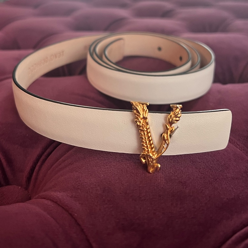 White, thin Versace belt.